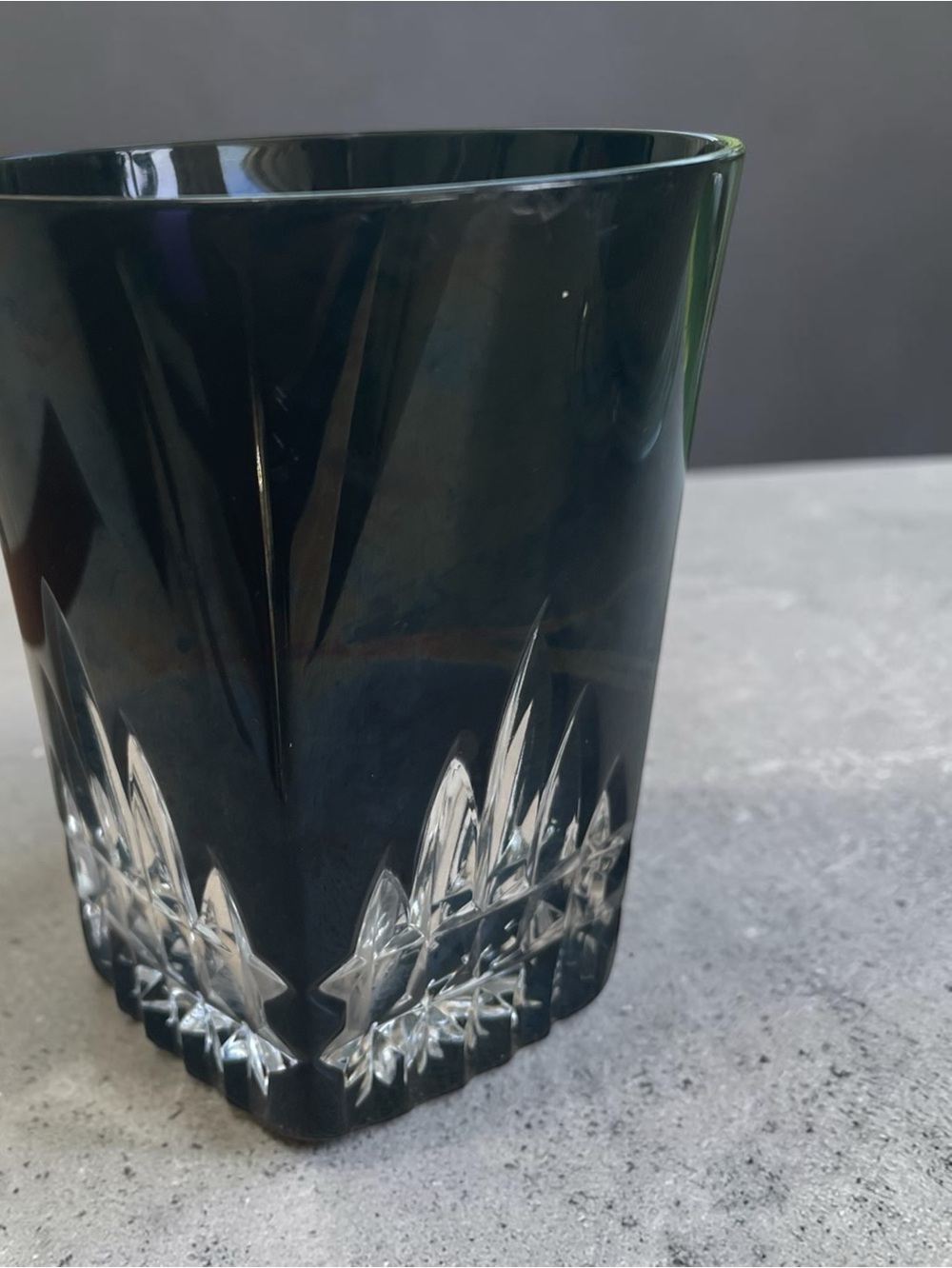 Whiskey glass, black panels with starburst cuts, maker unknown
